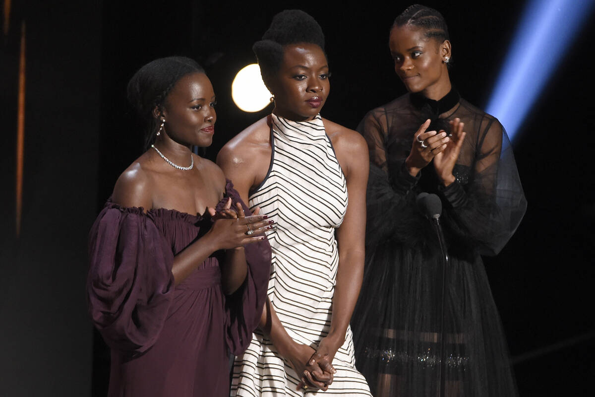 Lupita Nyong'o, from left, Danai Gurira, and Letitia Wright accept the award for outstanding mo ...