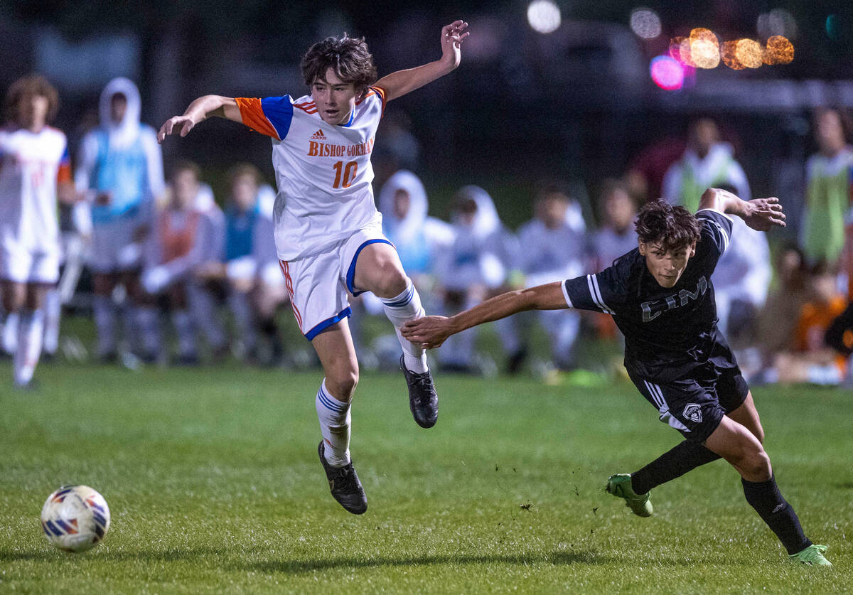 Bishop Gorman's Luke Parker (10) is upended by Cimarron's Angel Robles (16) during the first ha ...