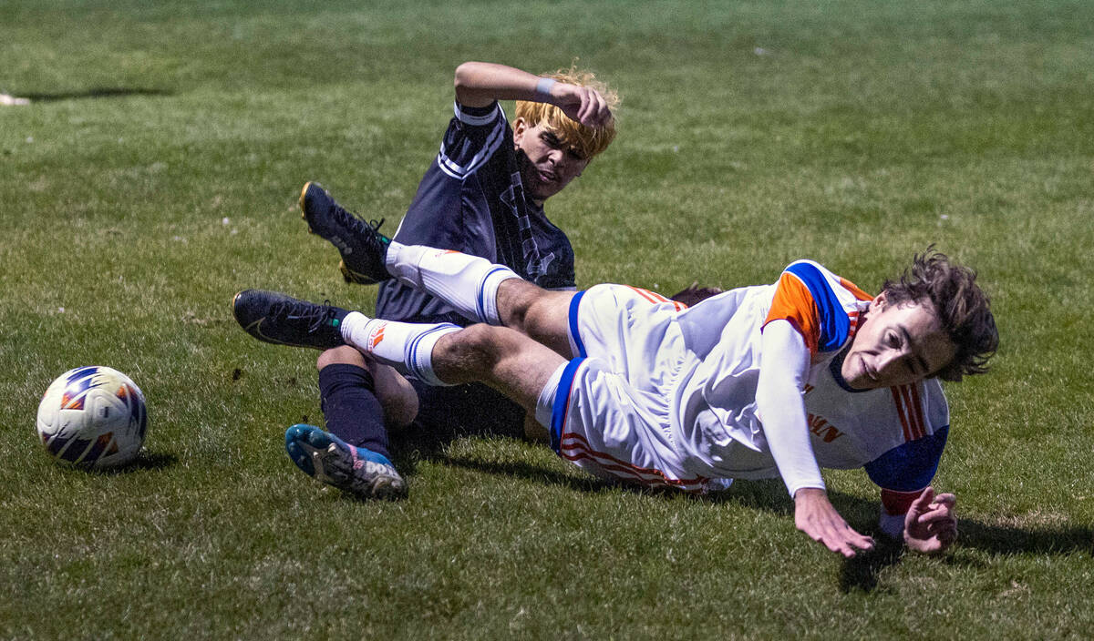 Cimarron's Jecsan Villasenor (10) tackles Bishop Gorman's Maddix Bordinhao (30) during the firs ...