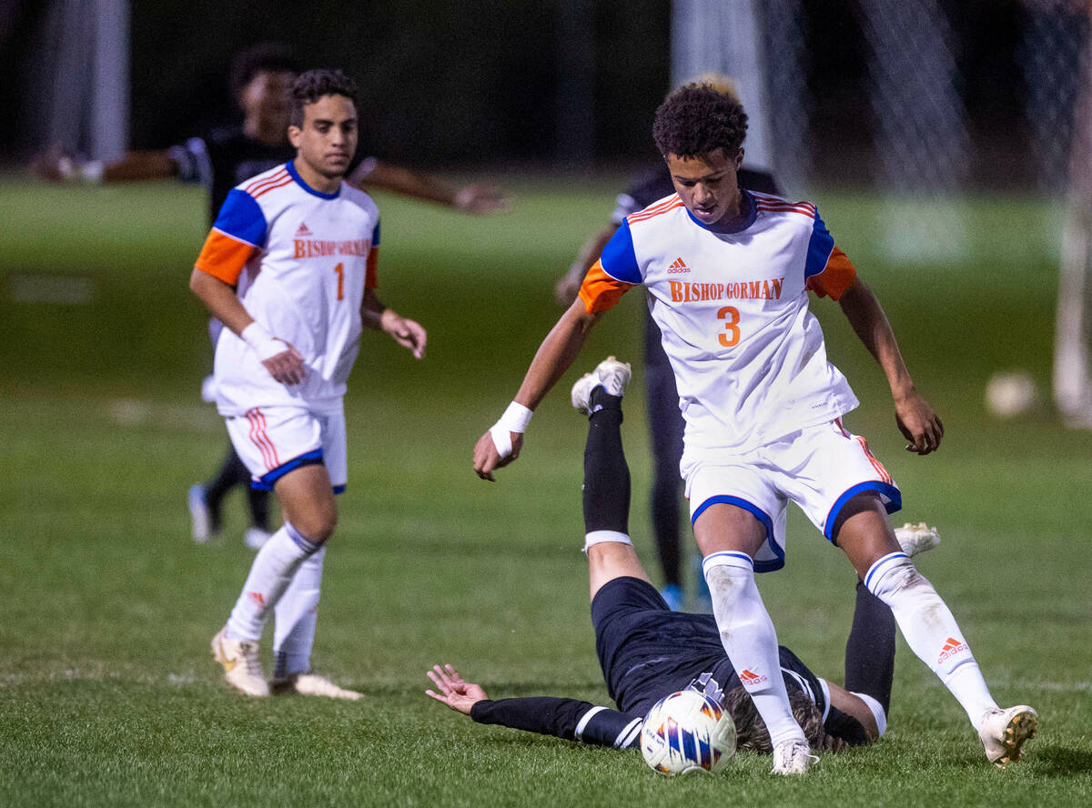 Bishop Gorman's Bronson Rolley (3) trips Cimarron's Jonathon Walter (8) during the second half ...