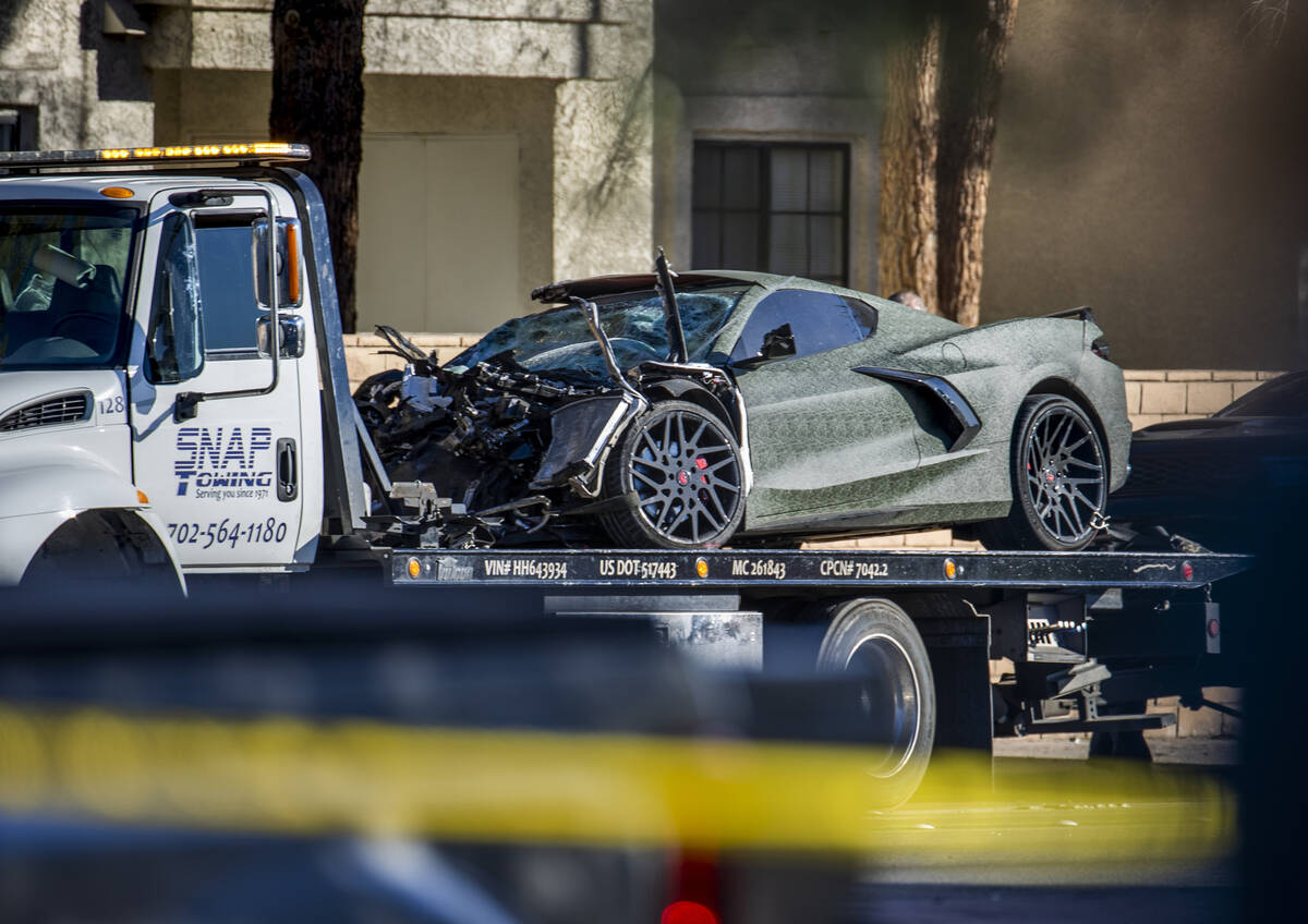 A damaged Corvette driven by Raiders wide receiver Henry Ruggs is loaded for transport after fa ...