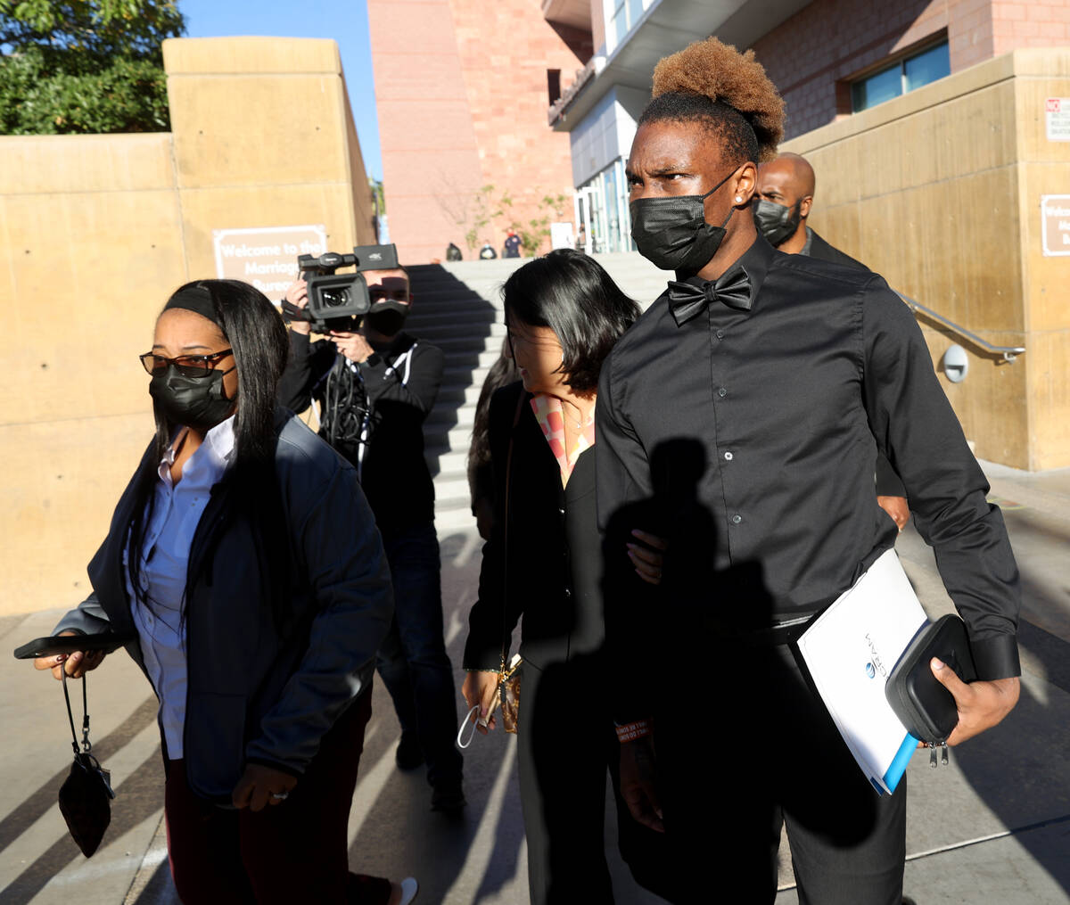 Henry Ruggs, right, walks out of the Regional Justice Center in Las Vegas Monday, Nov. 22, 2021 ...