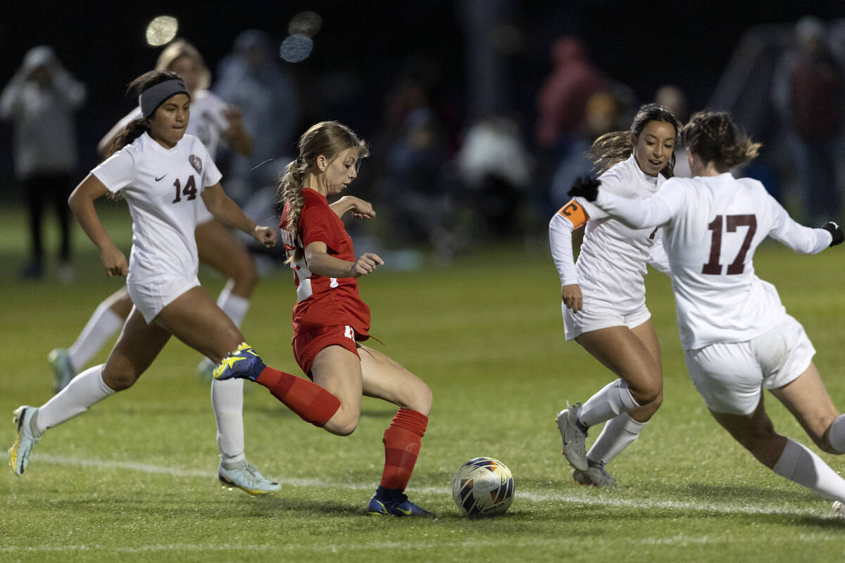 Coronado’s Tia Garr, second from left, winds up to shoot the game-winning goal while Des ...