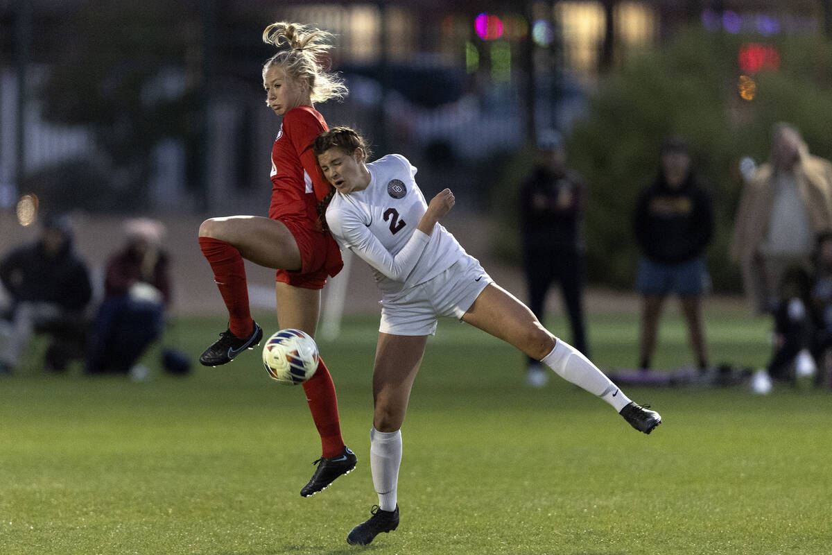 Coronado’s Cate Gusick, left, collides after a header with Desert Oasis’ Kate Per ...