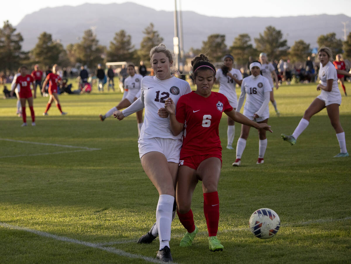 Desert Oasis’ Taylor Wehrer (12) dribbles against Coronado’s Milan Cordone (6) du ...