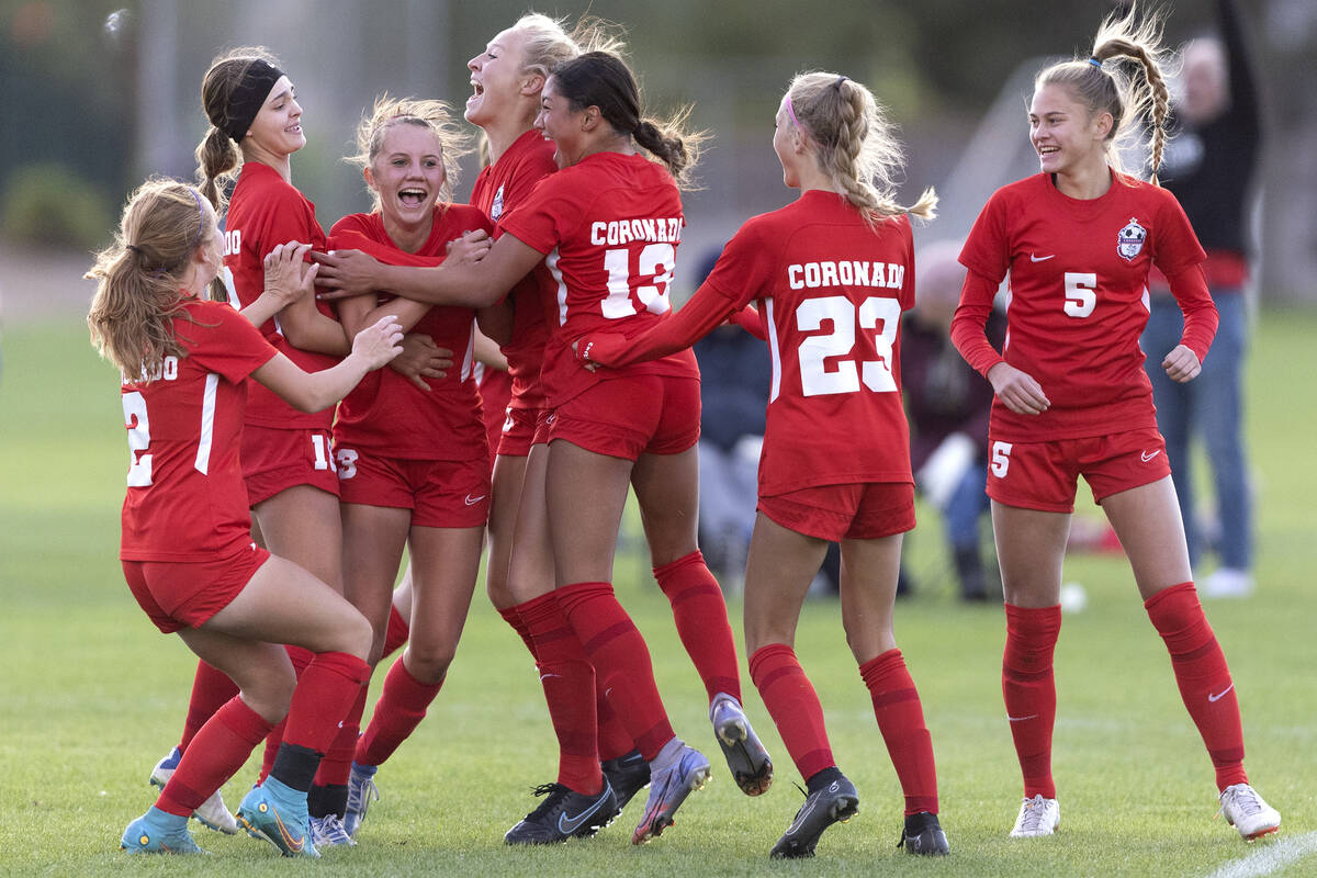 Coronado rallies around Liliana Schuth, third from left, after she scored a goal during a Class ...