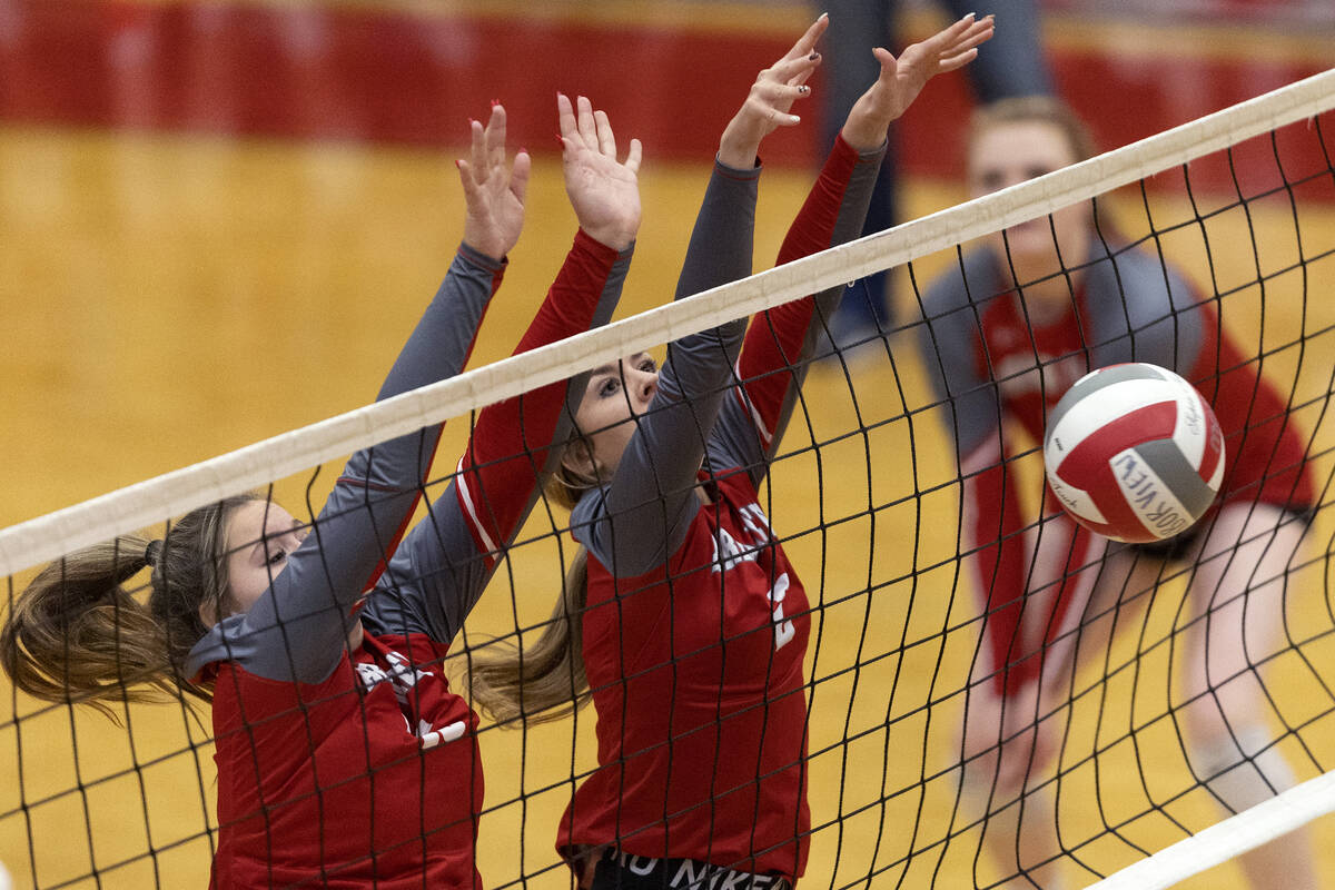 Arbor View’s Piper Halvorson, left, and Evelyn Herrera, center, kill a shot by Basic dur ...