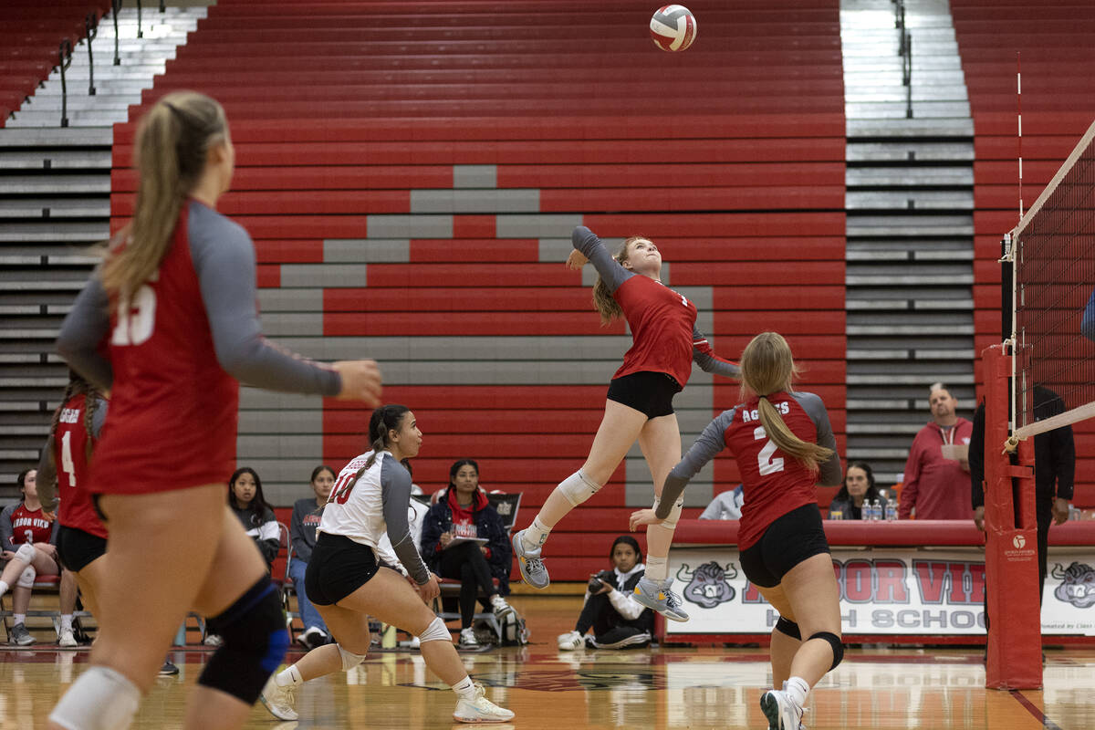 Arbor View’s Madison Garvin, center right, spikes to Basic during a Class 4A girls state ...