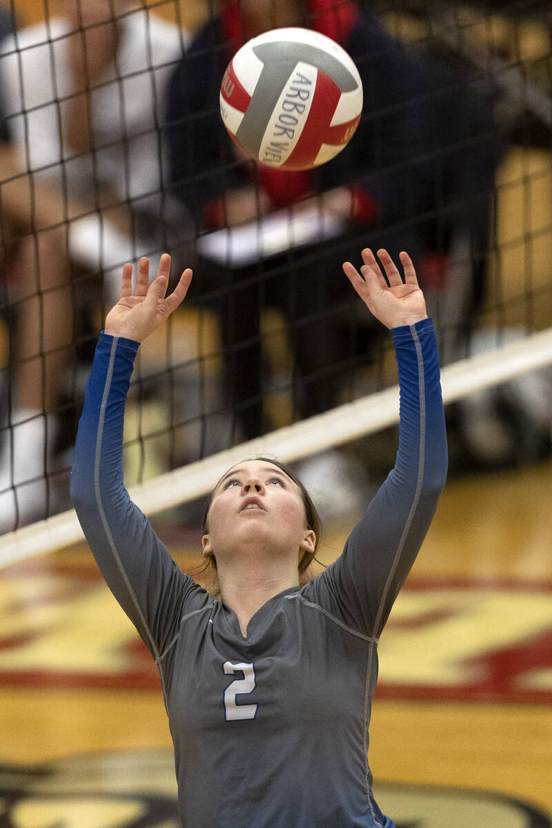 Basic’s Madison Ortiz (2) sets the ball during a Class 4A girls state volleyball quarter ...
