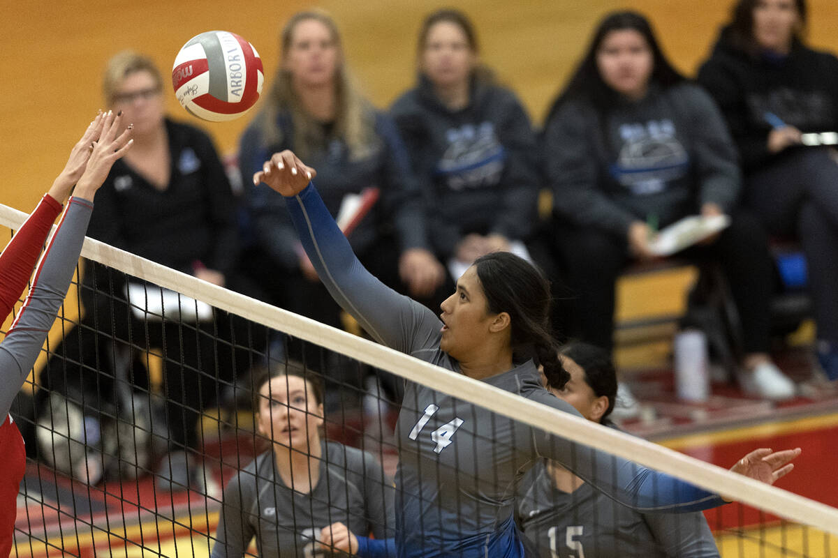 Basic’s Taylah Paepule (14) spikes to Arbor View during a Class 4A girls state volleybal ...