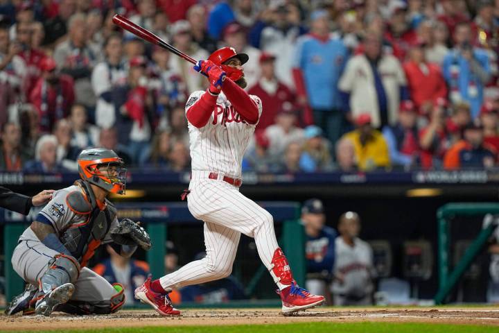 Philadelphia Phillies' Bryce Harper watches his two-run home run during the first inning in Gam ...