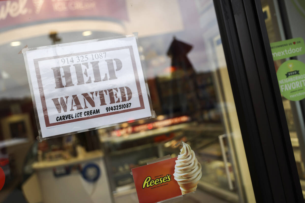 A help wanted sign in a storefront, Tuesday, Nov. 1, 2022, in Bedford, N.Y. The Federal Reserve ...