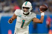 Miami Dolphins quarterback Tua Tagovailoa throws during the second half of an NFL football game ...
