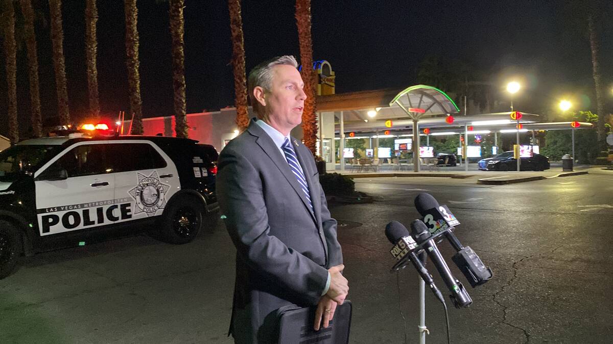Metropolitan Police Department Lt. Jason Johansson speaks to the media at the scene of a homici ...