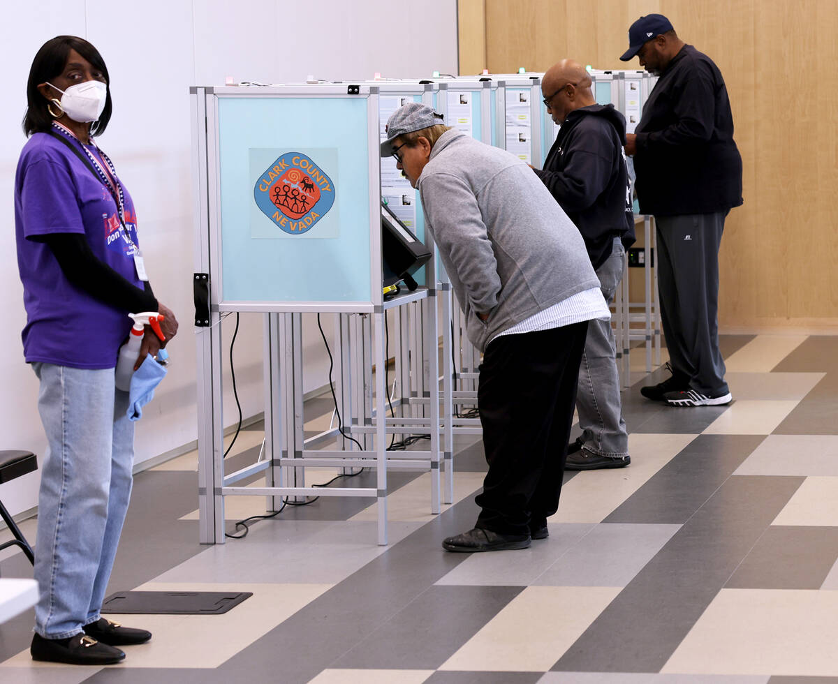 Voters cast their ballots at East Las Vegas Library polling location Thursday, Nov. 3, 2022. (K ...