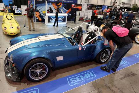 Mark Pagel of Oshkosh, Wis. checks out an all electric AC Cobra based on the 1965 AC Cobra in t ...
