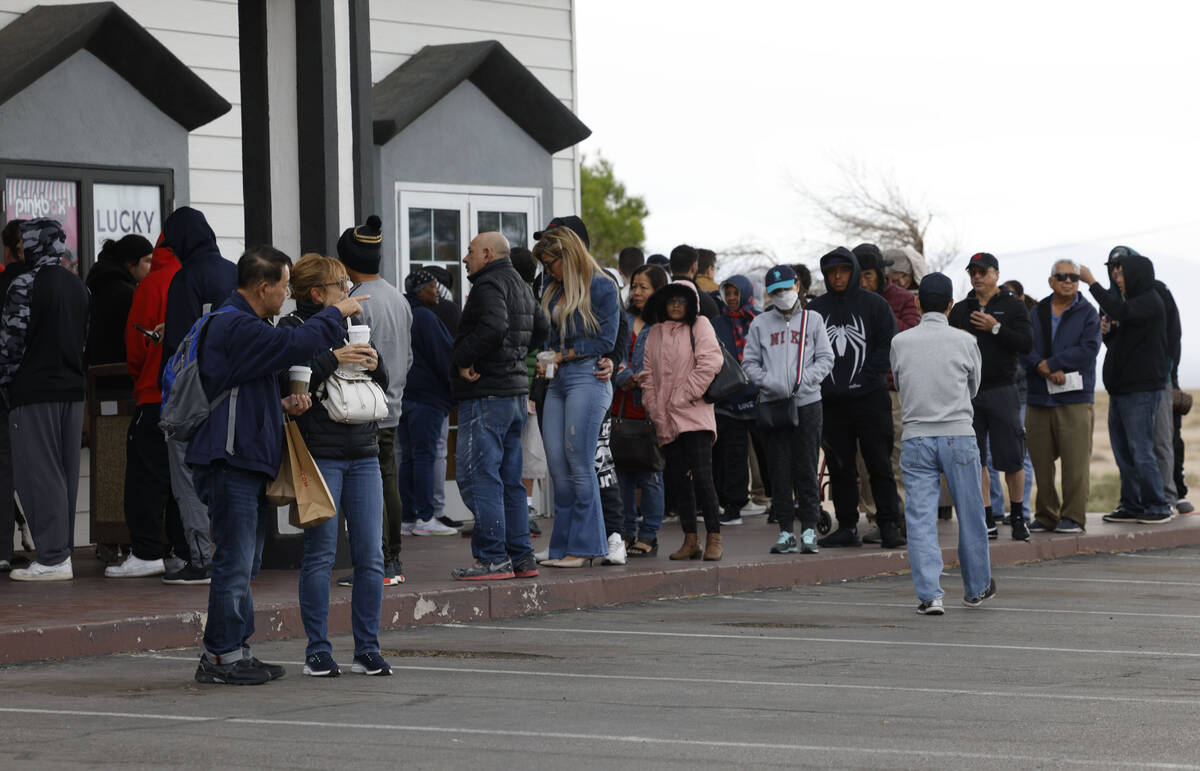 People wait in line to buy lottery tickets at the Lotto Store at Primm, just inside the Califor ...