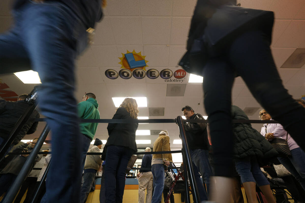 People wait in line to buy lottery tickets at the Lotto Store at Primm, just inside the Califor ...