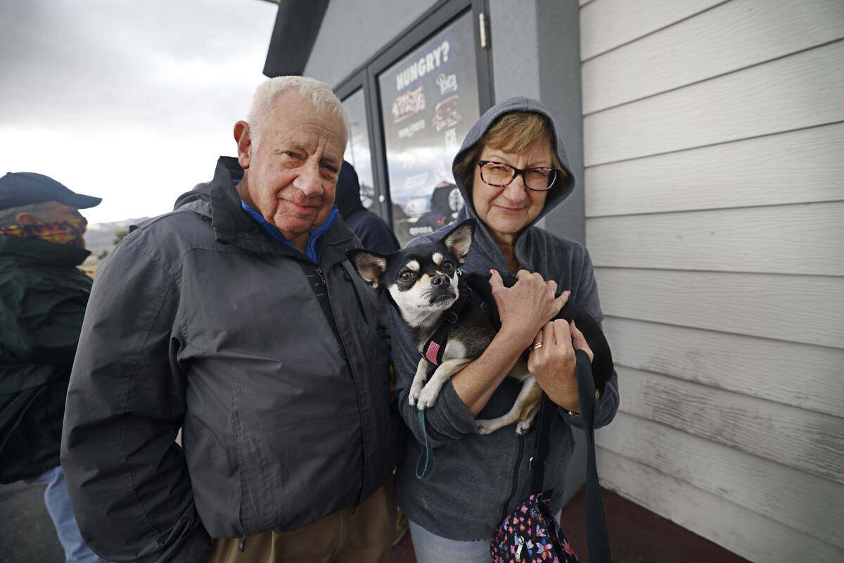 Ron Hack of Las Vegas waits in line to buy Powerball lottery tickets with his wife Peggy and th ...