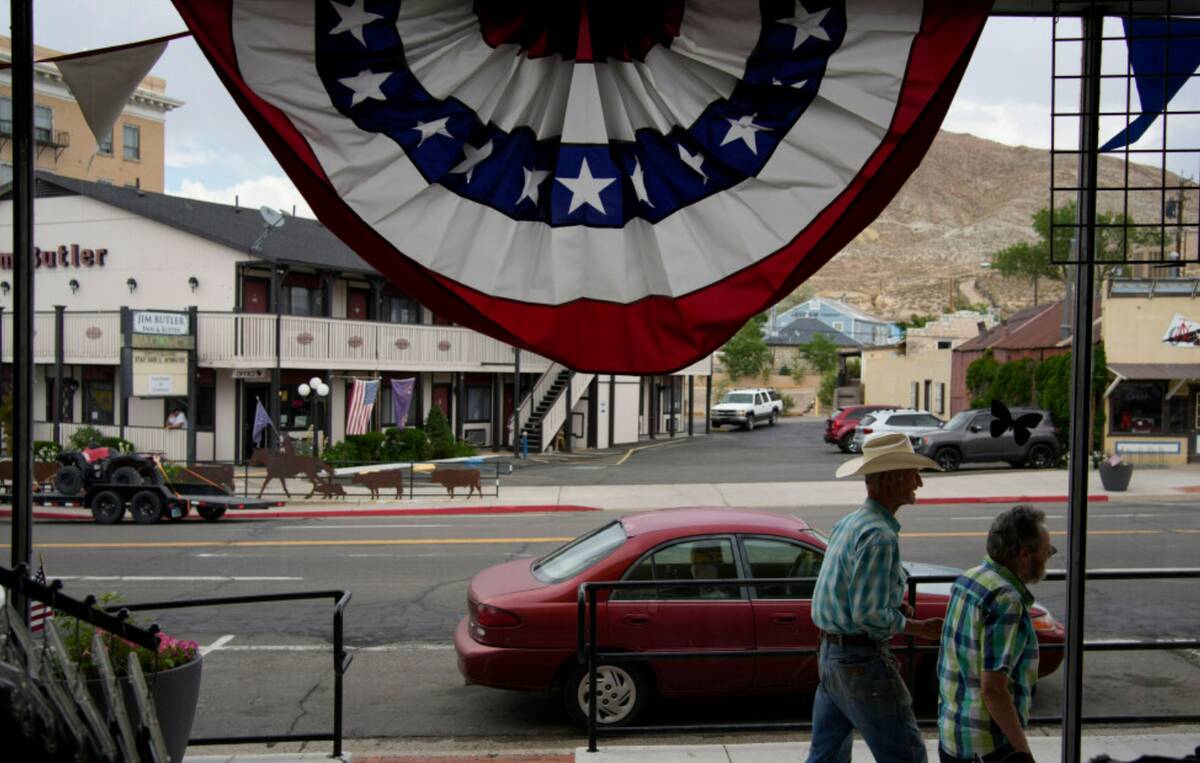 People walk along the main drag in the county seat of Nye County on July 18, 2022, in Tonopah. ...