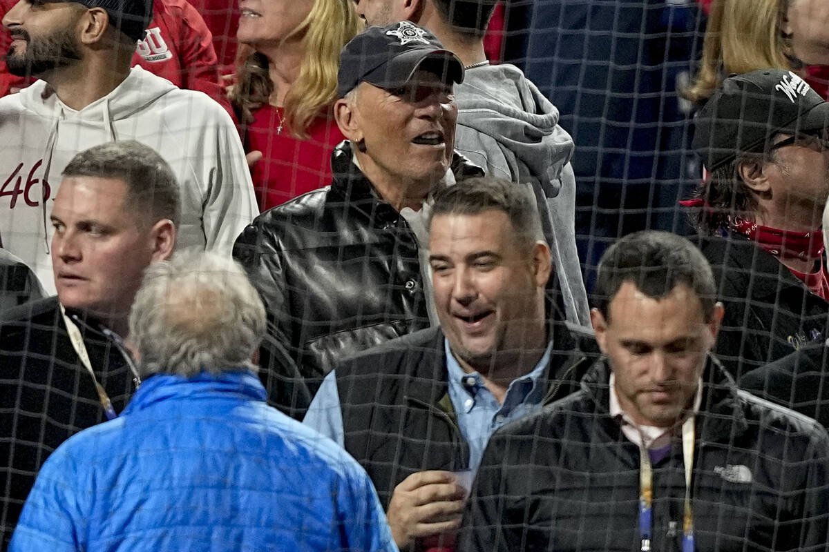 Singer Bruce Springsteen, top center, watches play during the seventh inning in Game 4 of baseb ...