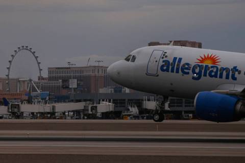 An Allegiant Air plane lands at Harry Reid International Airport on Tuesday, July 26, 2022, in ...