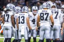 Raiders quarterback Derek Carr (4) calls a play in the huddle versus the New Orleans Saints dur ...