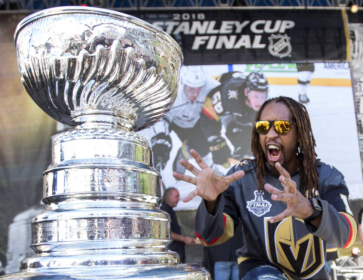 American rapper Lil Jon poses with the Stanley Cup before Game 1 of the NHL hockey Stanley Cup ...