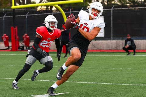 UNLV wide receiver Nick Williams makes the catch under pressure from defensive back Jerrae Will ...