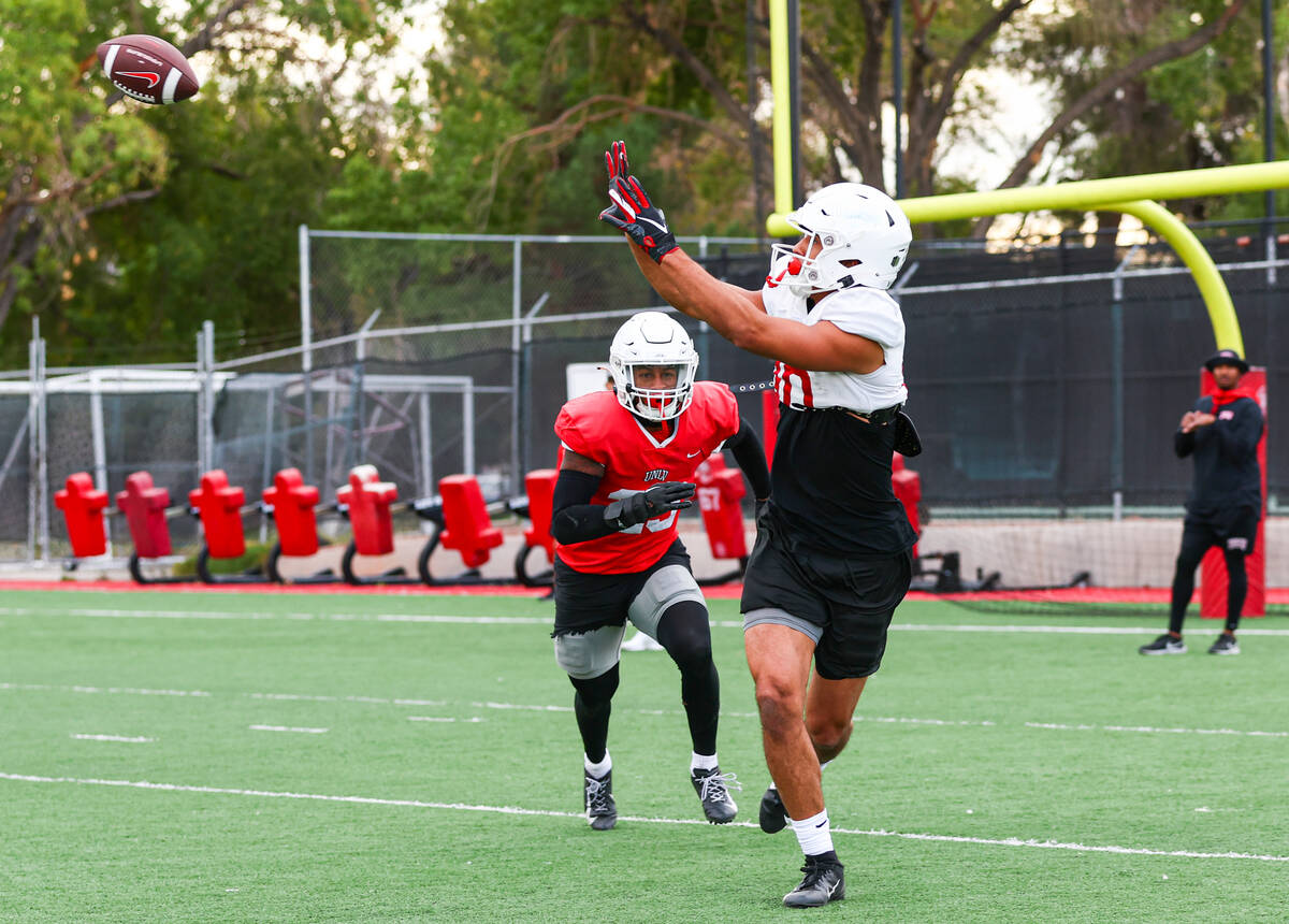 UNLV wide receiver Nick Williams makes the catch under pressure from defensive back Jerrae Will ...