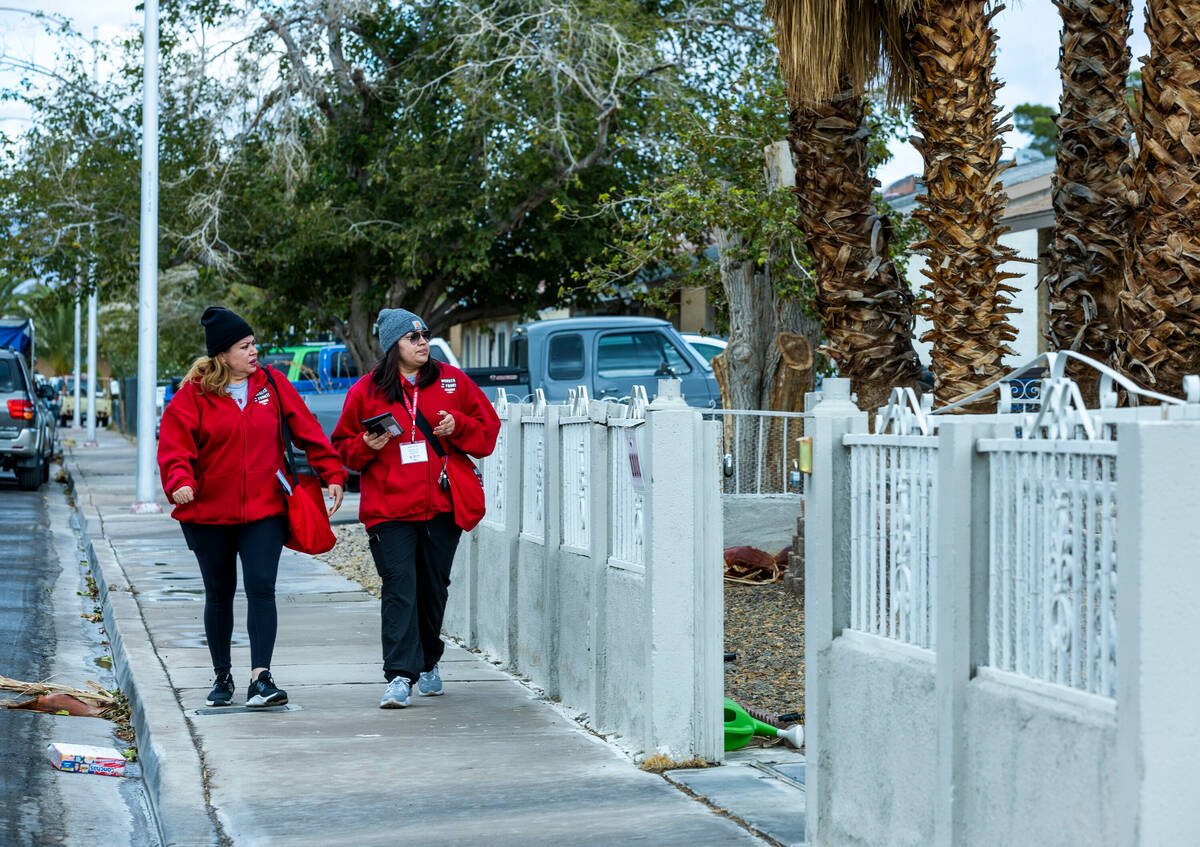 Mirian Cervantes, left, and her daughter Arlett Tovar, with the Culinary Union, canvass an east ...