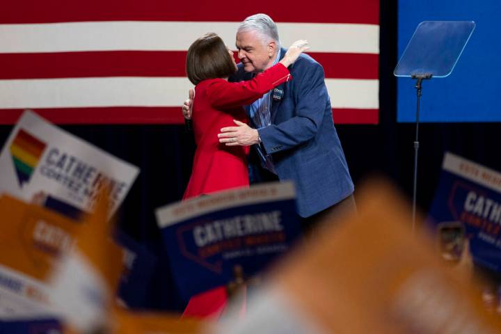 Sen. Catherine Cortez Masto, left, is embraced by Gov. Steve Sisolak as she takes the stage dur ...