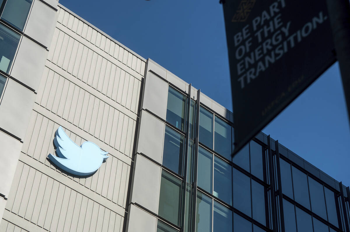A Twitter logo hangs outside the company's San Francisco offices on Tuesday, Nov. 1, 2022. Empl ...