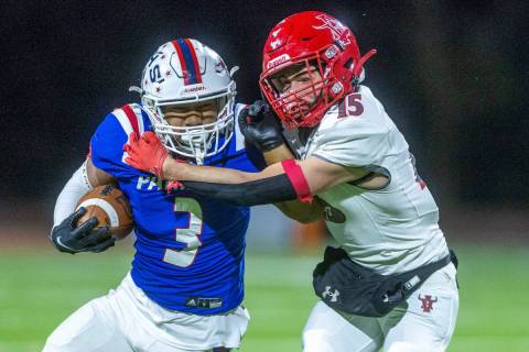 Liberty RB Isaiah Lauofo (3) looks for more yards against Arbor SS Tanner Aitken (15) during th ...