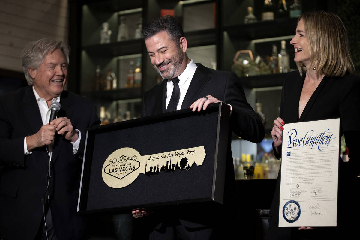 Clark County Commissioner Tick Segerblom, left, presents Jimmy Kimmel with a key to the Las Veg ...