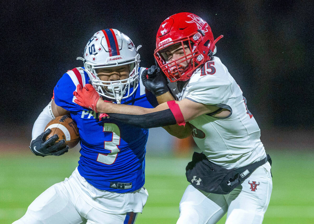 Liberty RB Isaiah Lauofo (3) looks for more yards against Arbor SS Tanner Aitken (15) during th ...