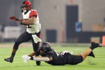 UNLV Rebels linebacker Kyle Beaudry (44) tackles San Diego State Aztecs running back Greg Bell ...