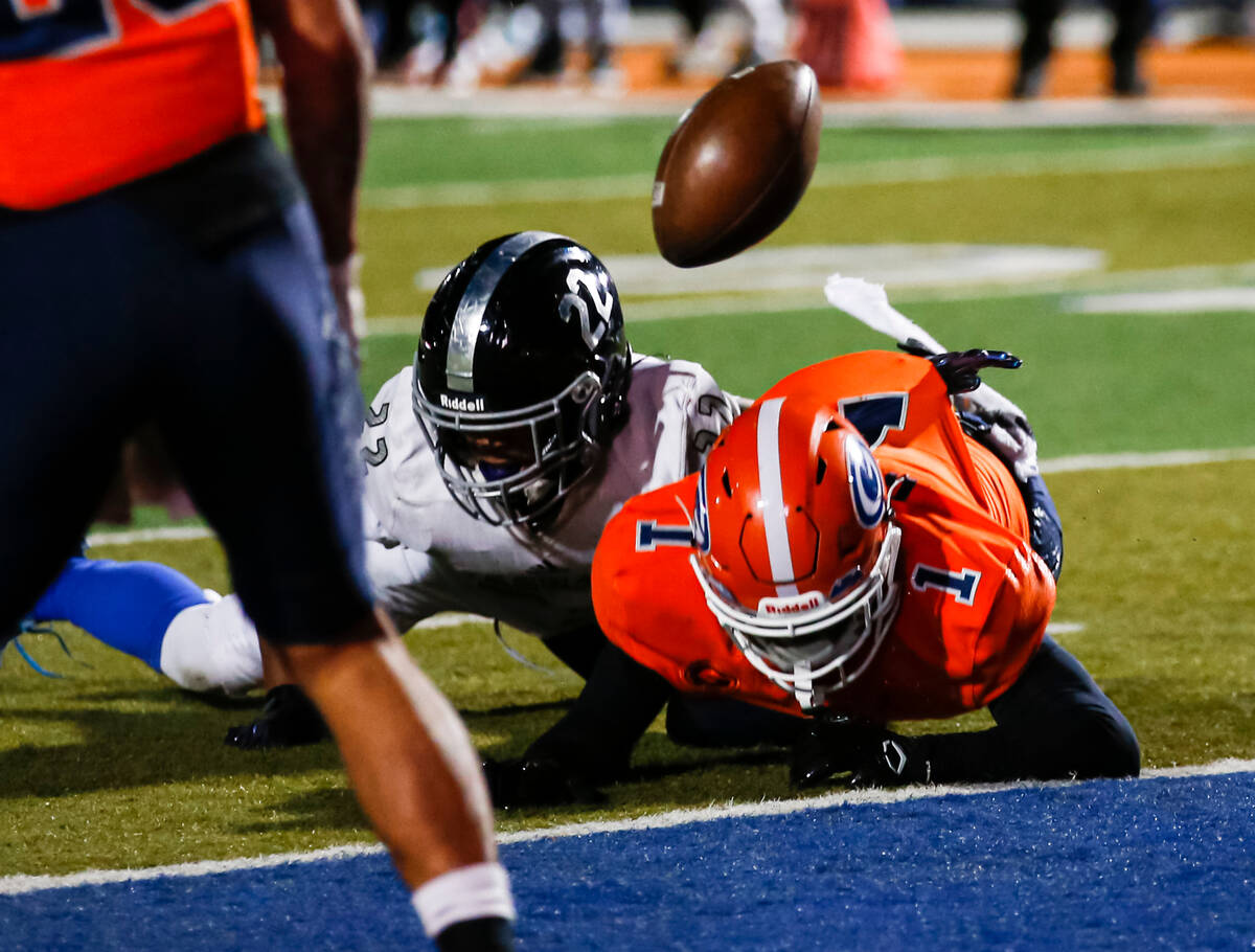 Desert Pines’ Trey Jackson (22) breaks up a pass intended for Bishop Gorman’s Zac ...