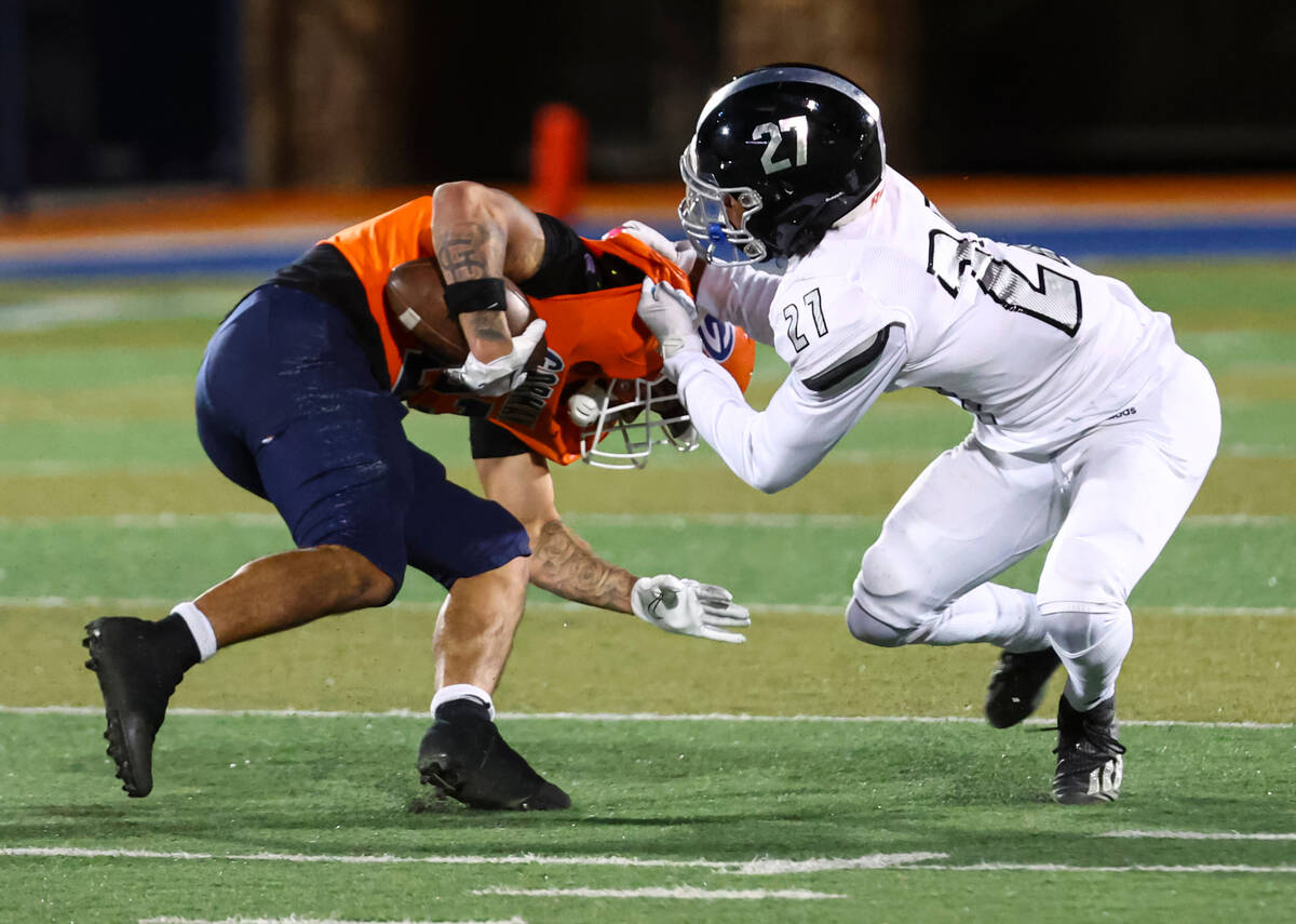 Desert Pines’ RJ Tiggs (27) tackles Bishop Gorman’s Trech Kekahuna (23) during th ...