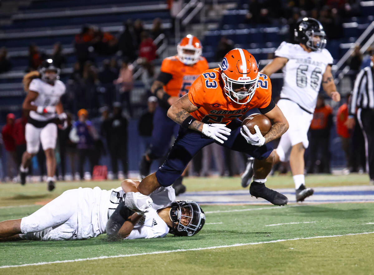 Bishop Gorman’s Trech Kekahuna (23) gets stopped by Desert Pines’ Lono Solomonn ( ...