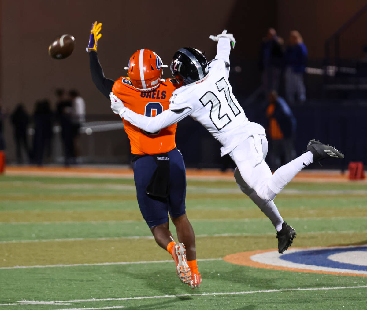 Desert Pines’s RJ Tiggs (27) breaks up a pass intended for Bishop Gorman’s Elija ...