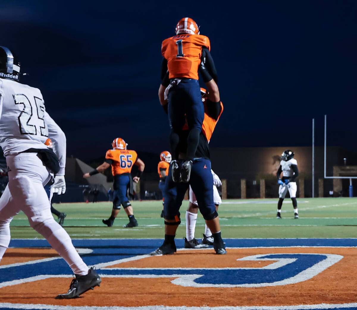 Bishop Gorman’s Zachariah Branch (1) celebrates his touchdown with a teammate during the ...