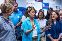 Senator Amy Klobuchar, center, speaks beside Representative Susie Lee, left, and Tiffany Muller ...