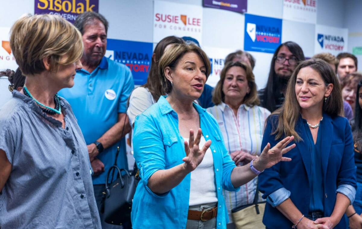 Senator Amy Klobuchar, center, speaks beside Representative Susie Lee, left, and Tiffany Muller ...