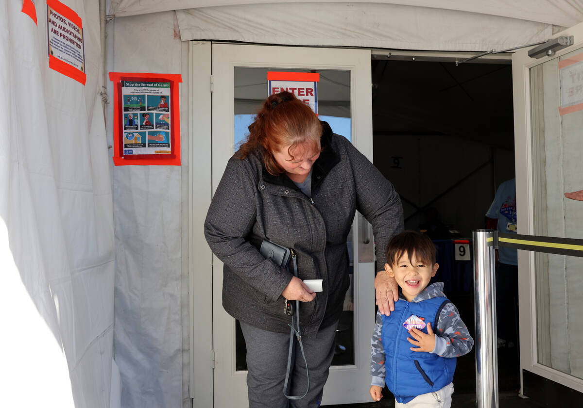 Wendy Belton and her son Sammy, 3, of Las Vegas, don their “I VOTED” stickers aft ...