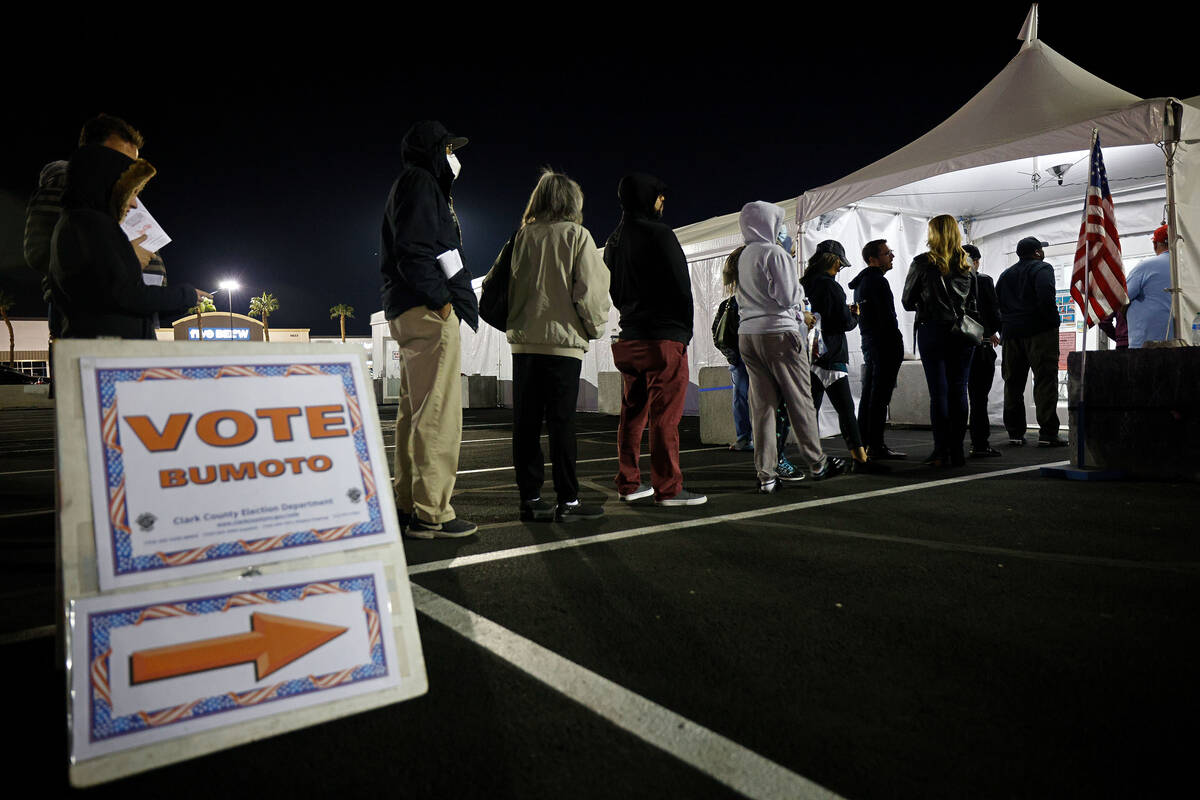 People wait in line at Silverado Ranch Plaza, an early voting location, Friday, Nov. 4, 2022, i ...
