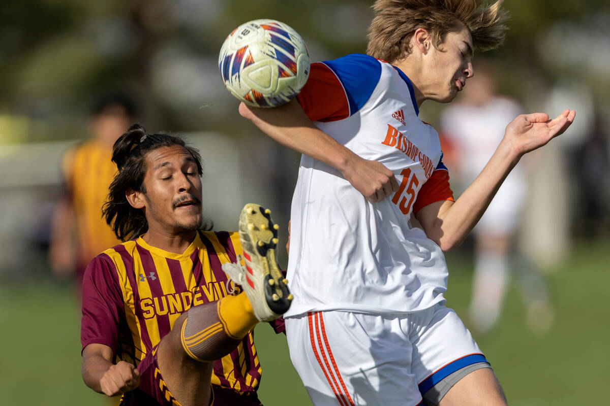 Eldorado’s Esteban Paz, left, kicks to defend while Bishop Gorman’s Chase Stewar ...