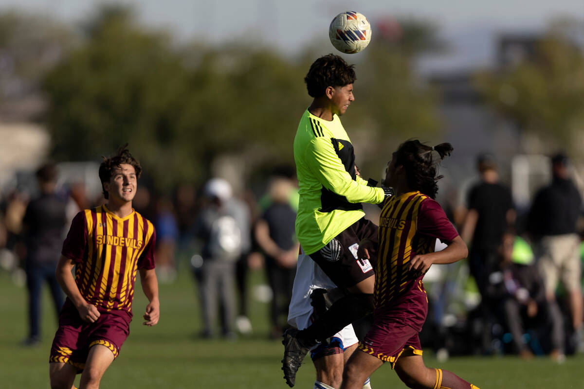 Eldorado goalkeeper Jose Barriga heads to save the ball during the Class 5A boys soccer souther ...