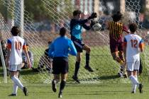 Bishop Gorman’s Devon Hume (24) saves a shot on goal by Eldorado during the Class 5A boy ...