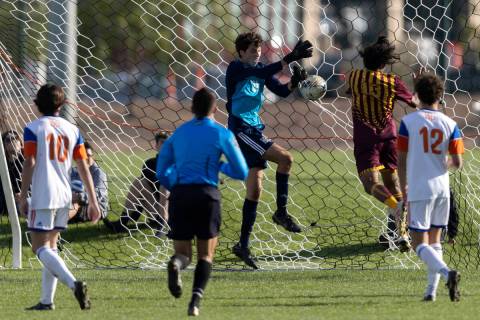 Bishop Gorman’s Devon Hume (24) saves a shot on goal by Eldorado during the Class 5A boy ...